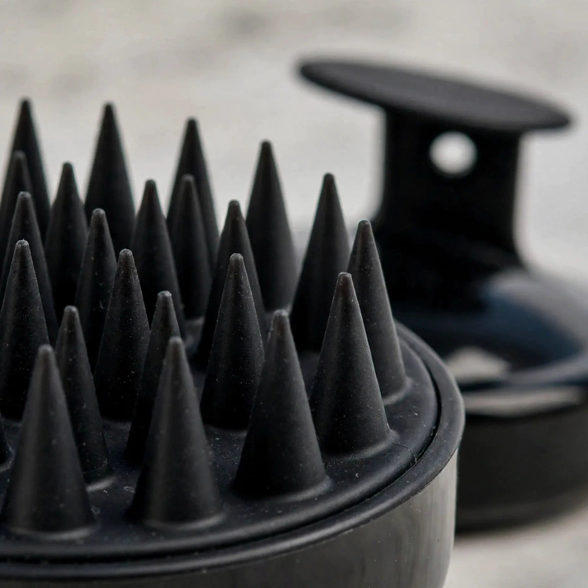 Close-up of soft silicone cone bristles on the scalp massager