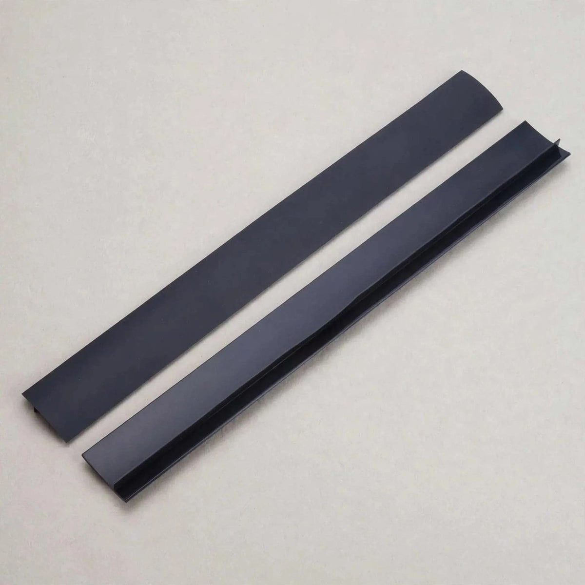 Two black silicone T-profile stove gap covers, 2-pack
