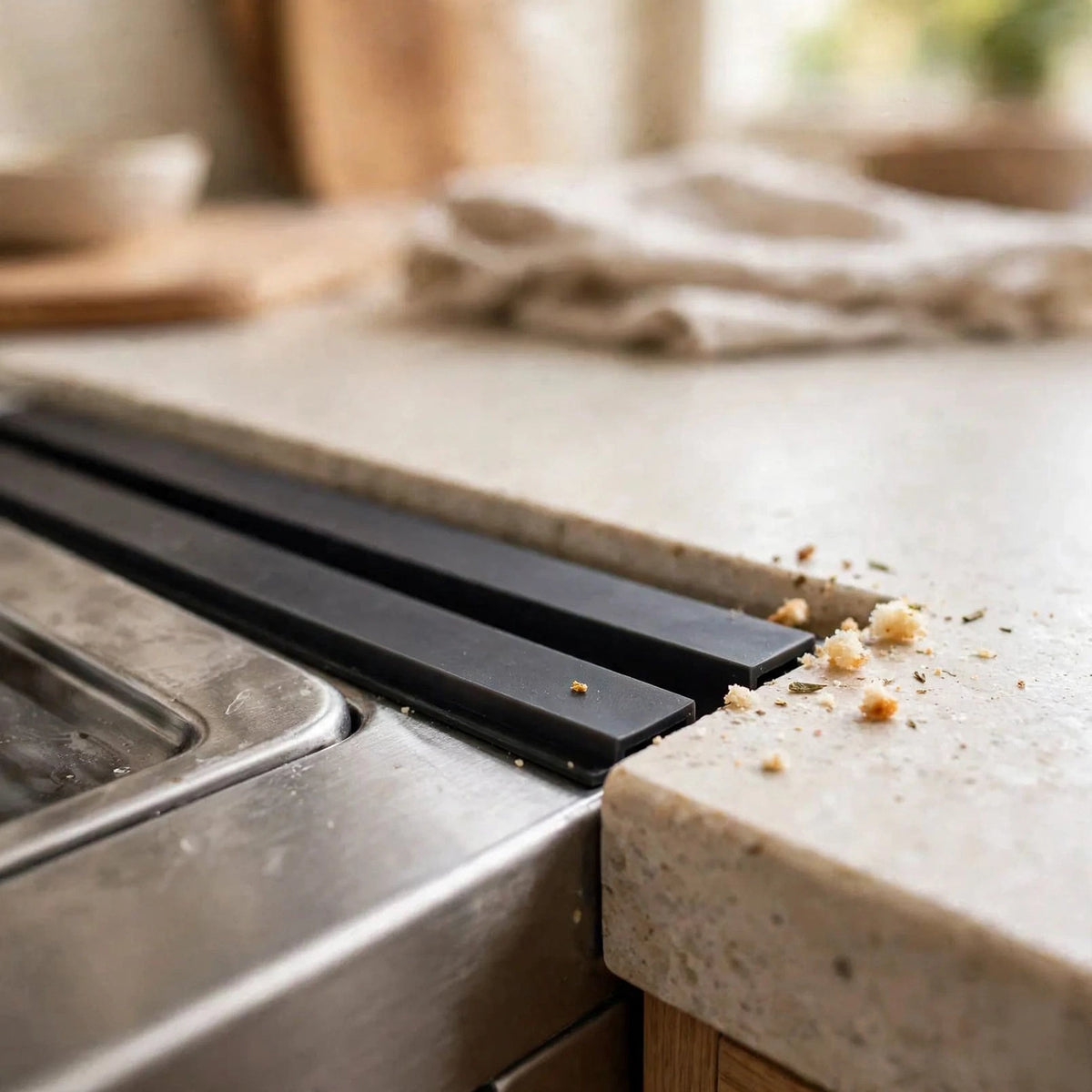 Black silicone stove gap covers installed between stove and countertop